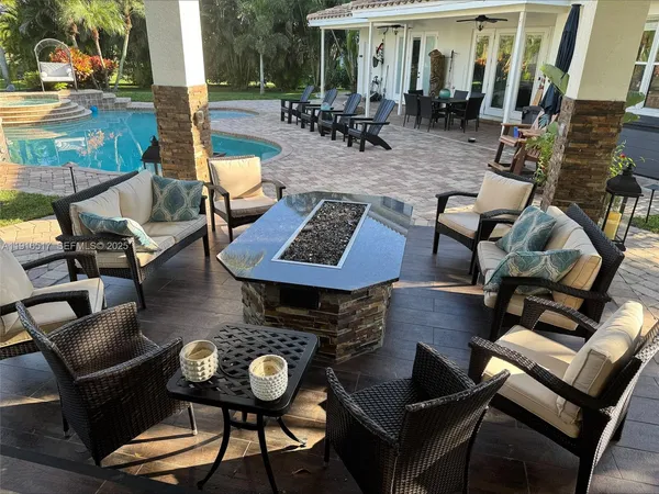 a view of a patio with couple of chairs