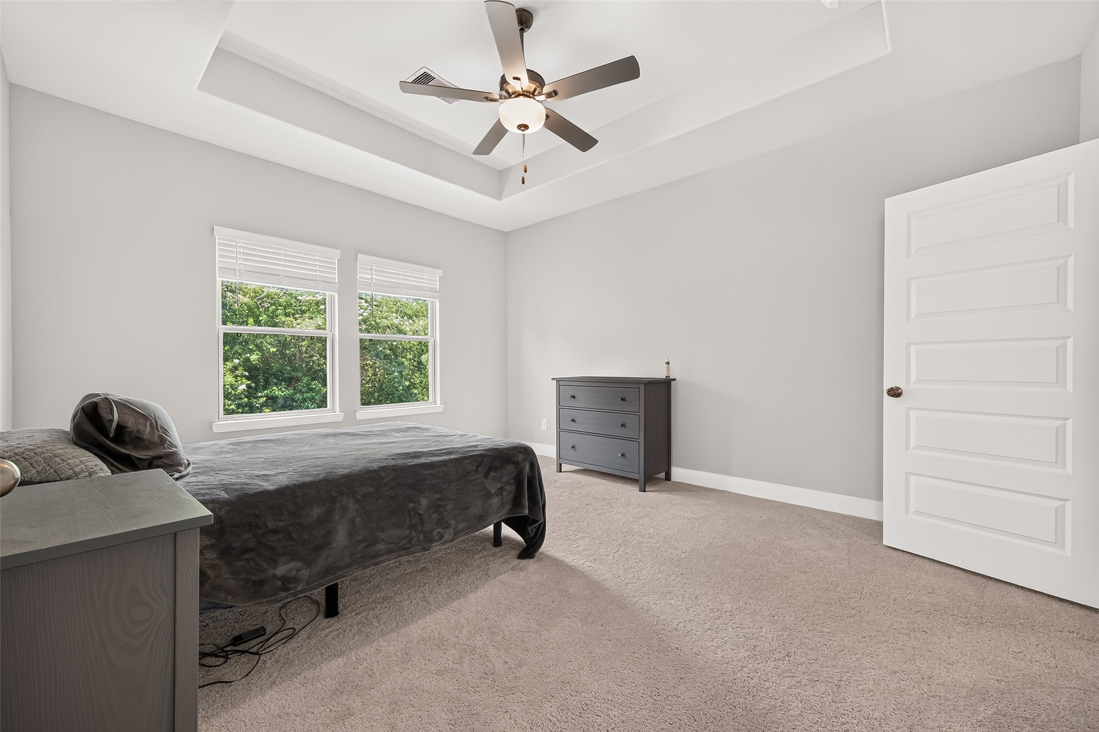 4004 Baja Lane Houston, TX 77045 - Photo 19 of 34 The exceptional proportions of the primary suite take center stage in this bright, beautifully neutral view. With an abundance of natural light streaming in and a soft, clean aesthetic, this inviting space offers a perfectly refreshing and quiet sanctuary.