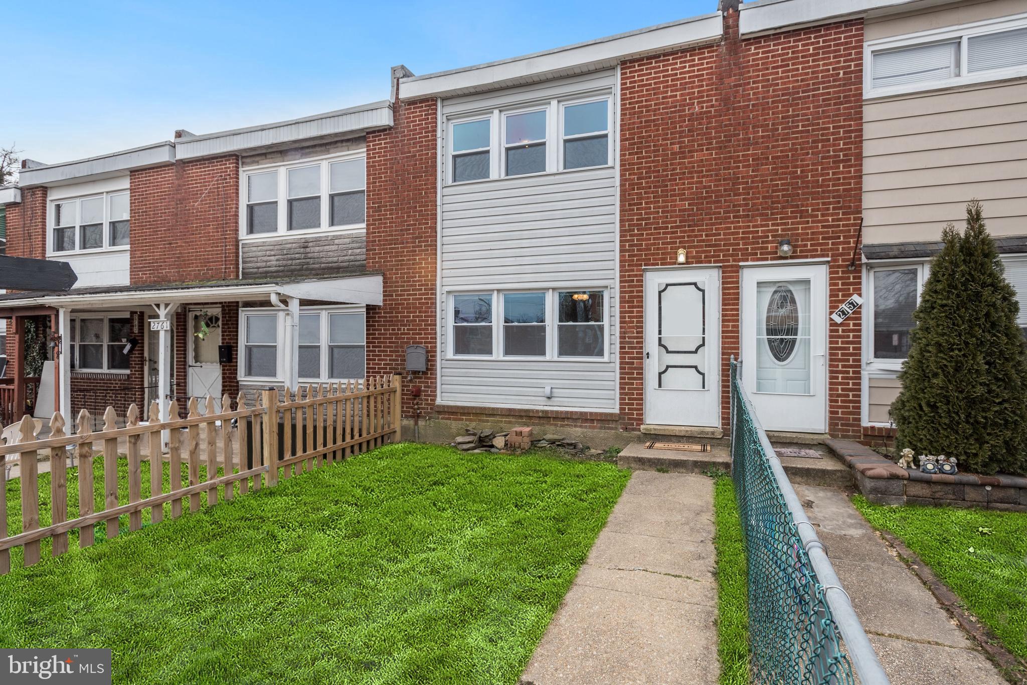 2759 Yarnall Road Baltimore, MD 21227 - Photo 2 of 21 a front view of a house with a yard