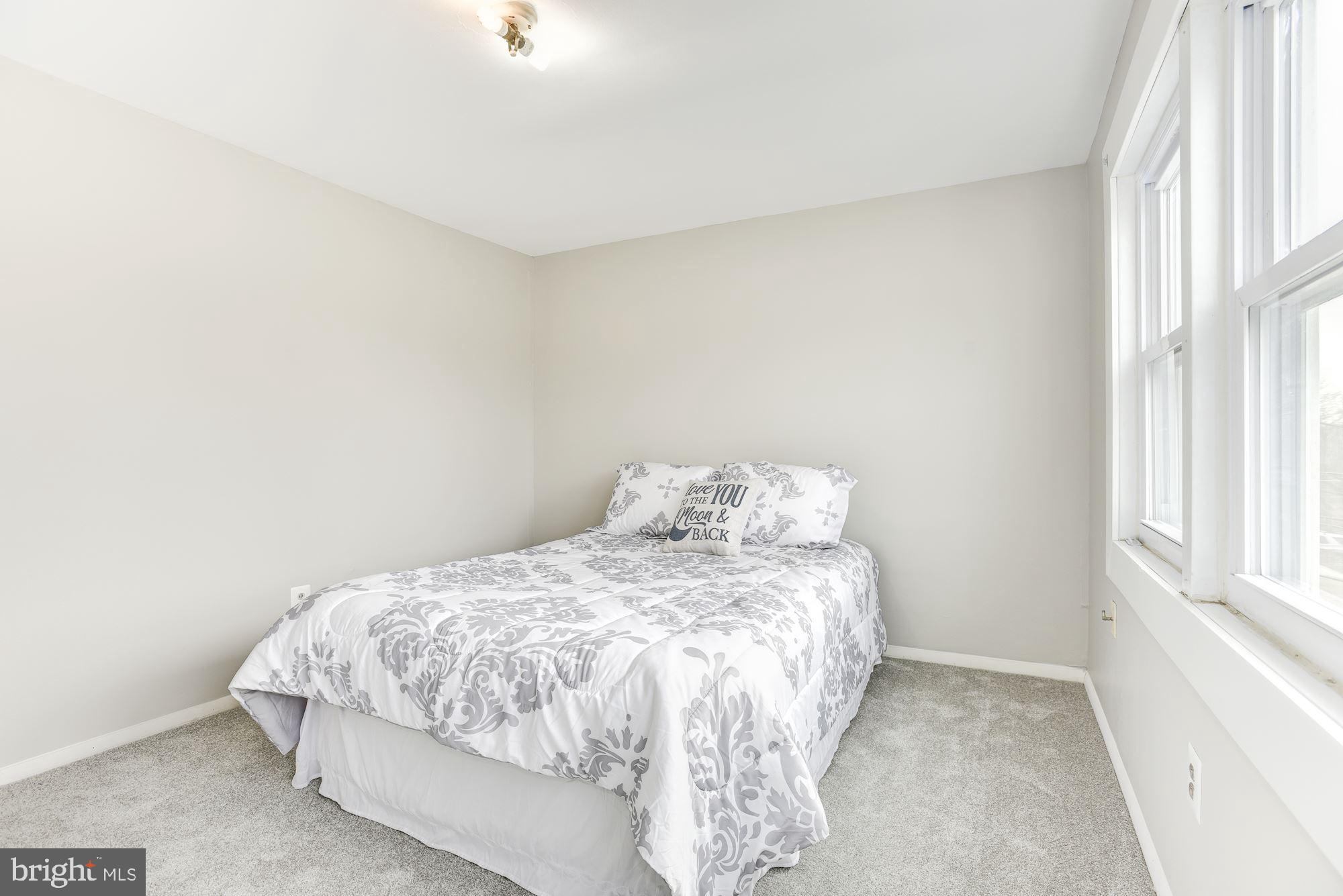 2759 Yarnall Road Baltimore, MD 21227 - Photo 11 of 21 a bedroom with a bed and a window