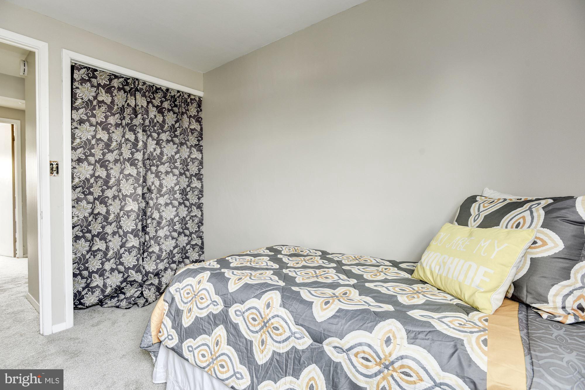 2759 Yarnall Road Baltimore, MD 21227 - Photo 15 of 21 a bedroom with a bed and a window