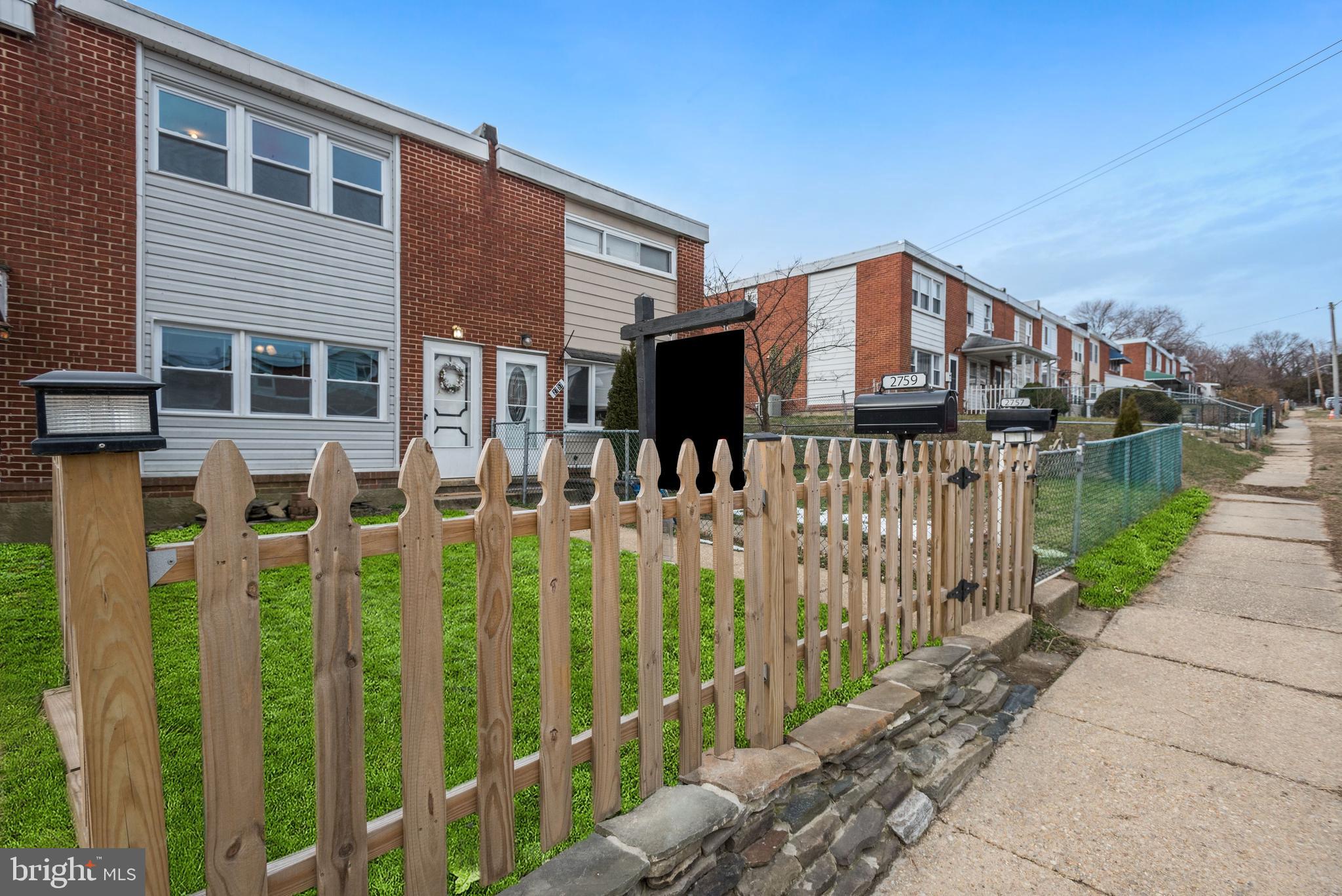 2759 Yarnall Road Baltimore, MD 21227 - Photo 18 of 21 a front view of house yard with patio