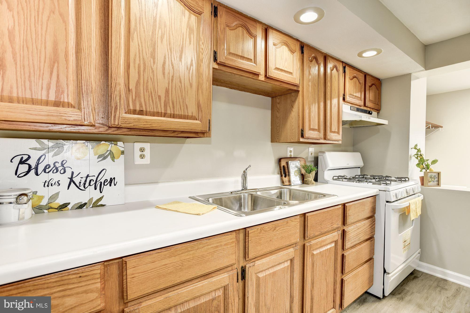 2759 Yarnall Road Baltimore, MD 21227 - Photo 6 of 21 a kitchen with stainless steel appliances granite countertop a sink and cabinets