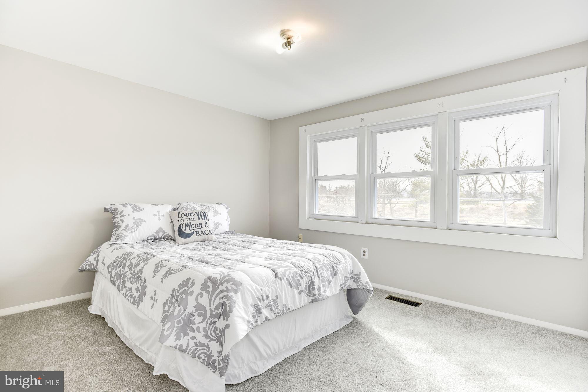 2759 Yarnall Road Baltimore, MD 21227 - Photo 10 of 21 a bedroom with a bed and a window