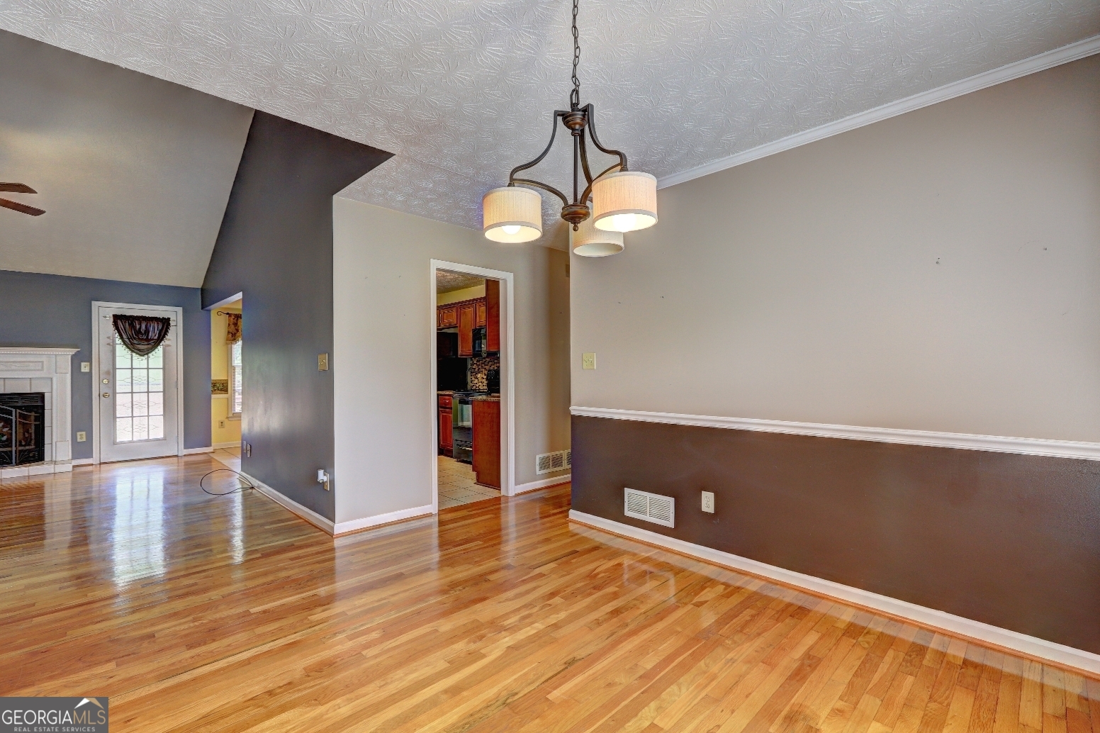 215 Laney Road McDonough, GA 30252 - Photo 14 of 38 a view of an empty room with wooden floor and a window