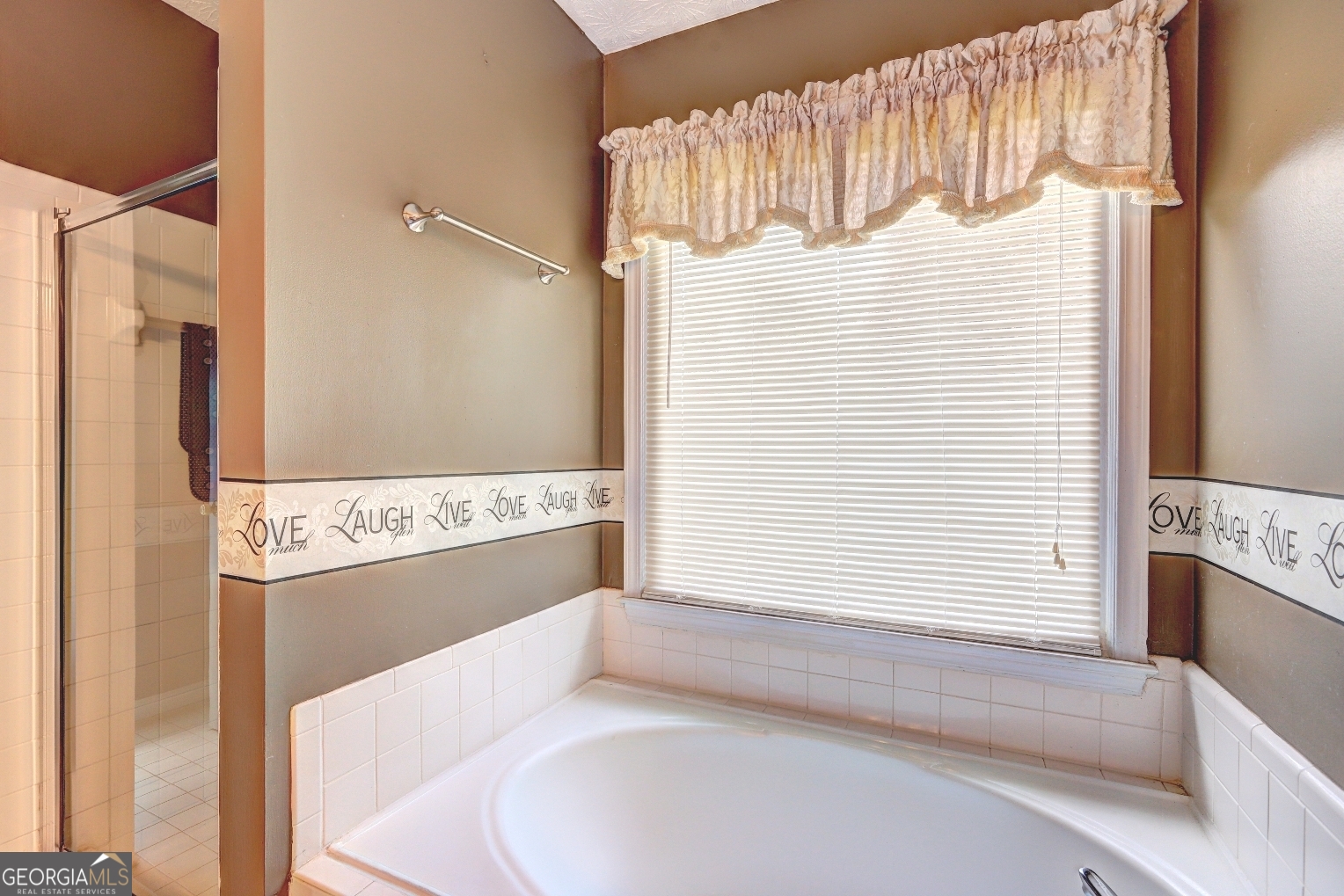 215 Laney Road McDonough, GA 30252 - Photo 20 of 38 a bathroom with a tub sink and mirror