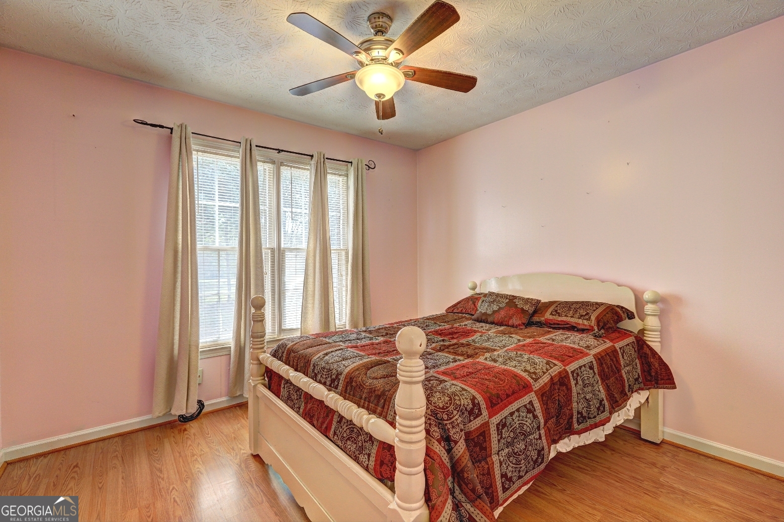 215 Laney Road McDonough, GA 30252 - Photo 23 of 38 a bedroom with a bed and a window