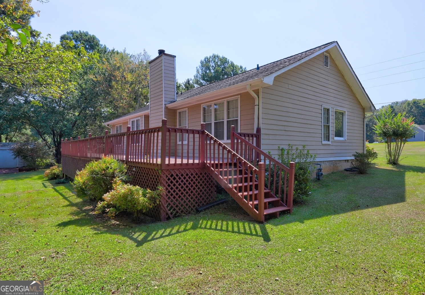 215 Laney Road McDonough, GA 30252 - Photo 30 of 38 a front view of a house with a yard table and chairs