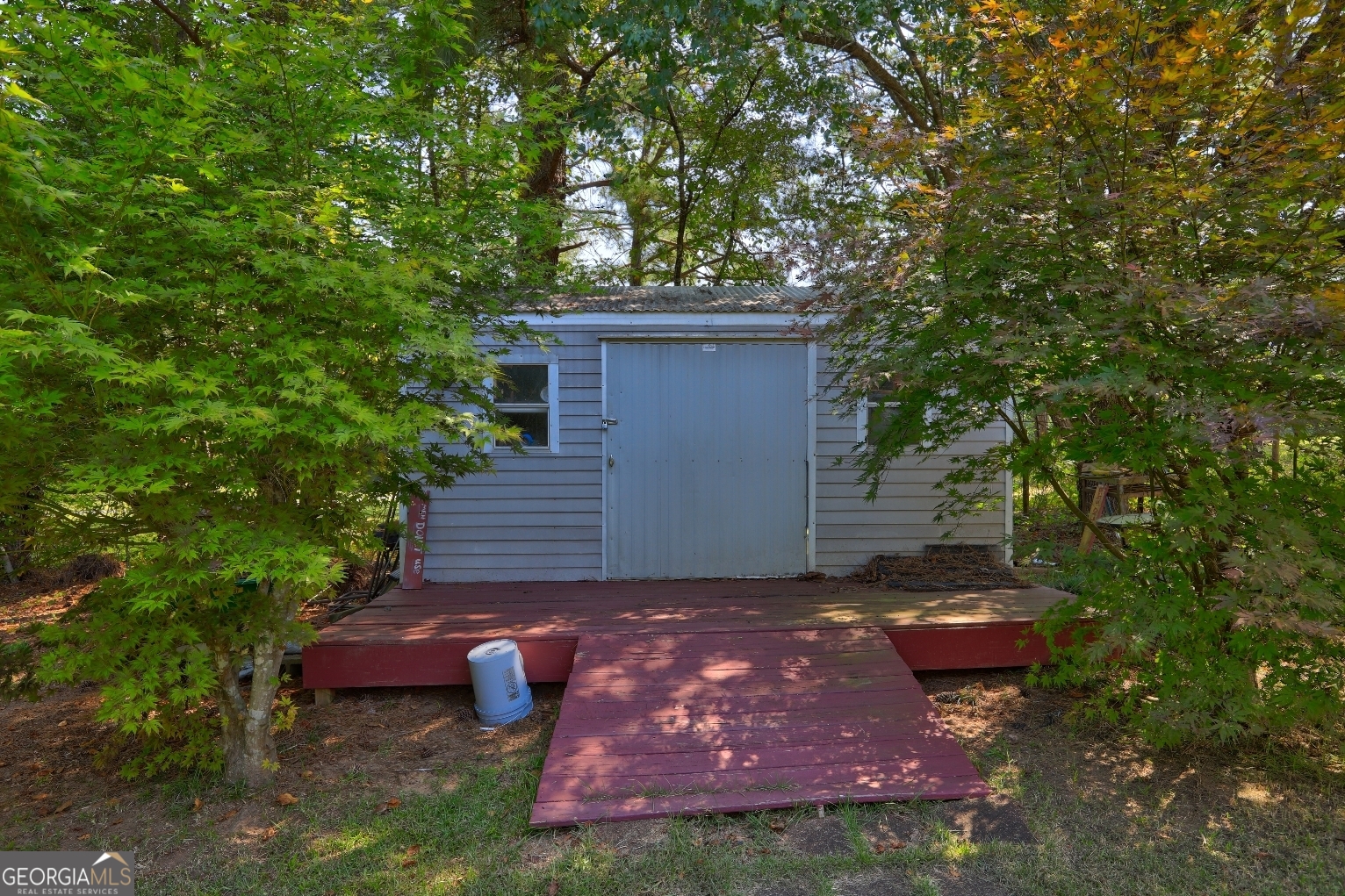 215 Laney Road McDonough, GA 30252 - Photo 31 of 38 a fire hydrant in the middle of a forest