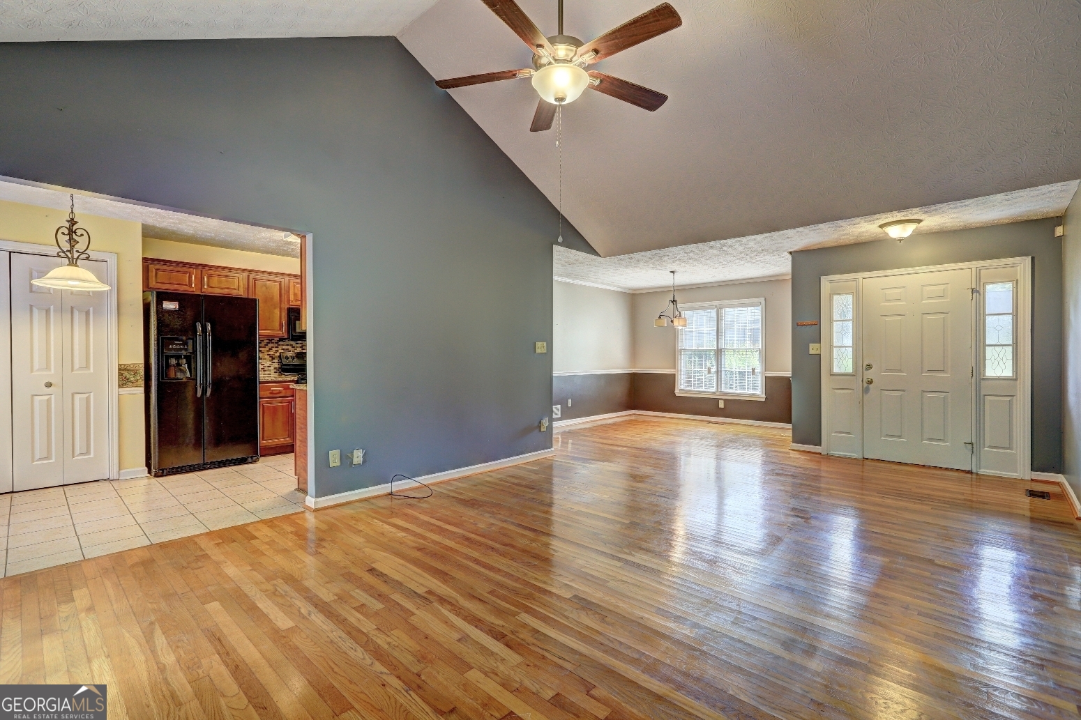 215 Laney Road McDonough, GA 30252 - Photo 4 of 38 a view of an empty room with wooden floor and a window