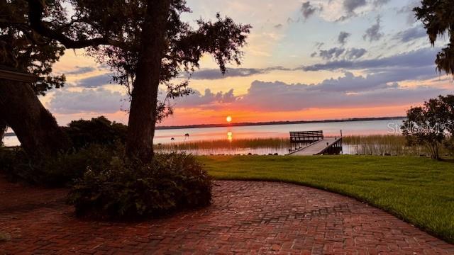 a view of a lake with a big yard