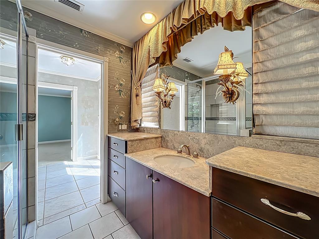 504 Banning Beach Road Tavares, FL 32778 - Photo 21 of 44 a bathroom with a sink and a mirror