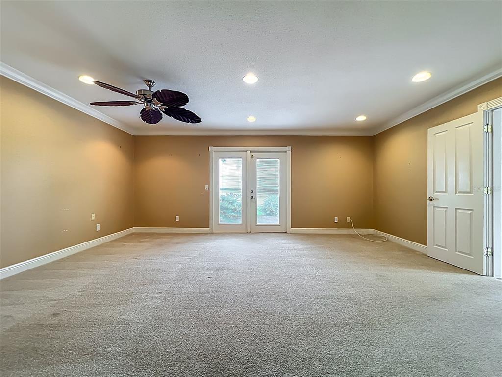 504 Banning Beach Road Tavares, FL 32778 - Photo 22 of 44 a view of an empty room with windows