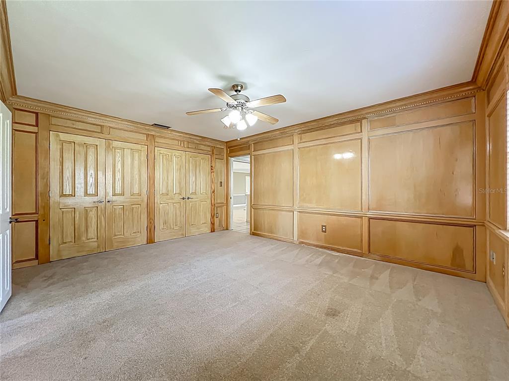 504 Banning Beach Road Tavares, FL 32778 - Photo 25 of 44 a view of an empty room with a ceiling fan