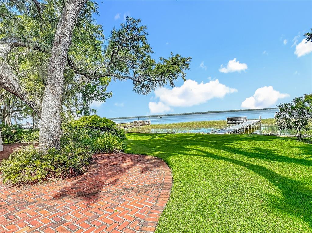 504 Banning Beach Road Tavares, FL 32778 - Photo 31 of 44 a view of a golf course with a garden