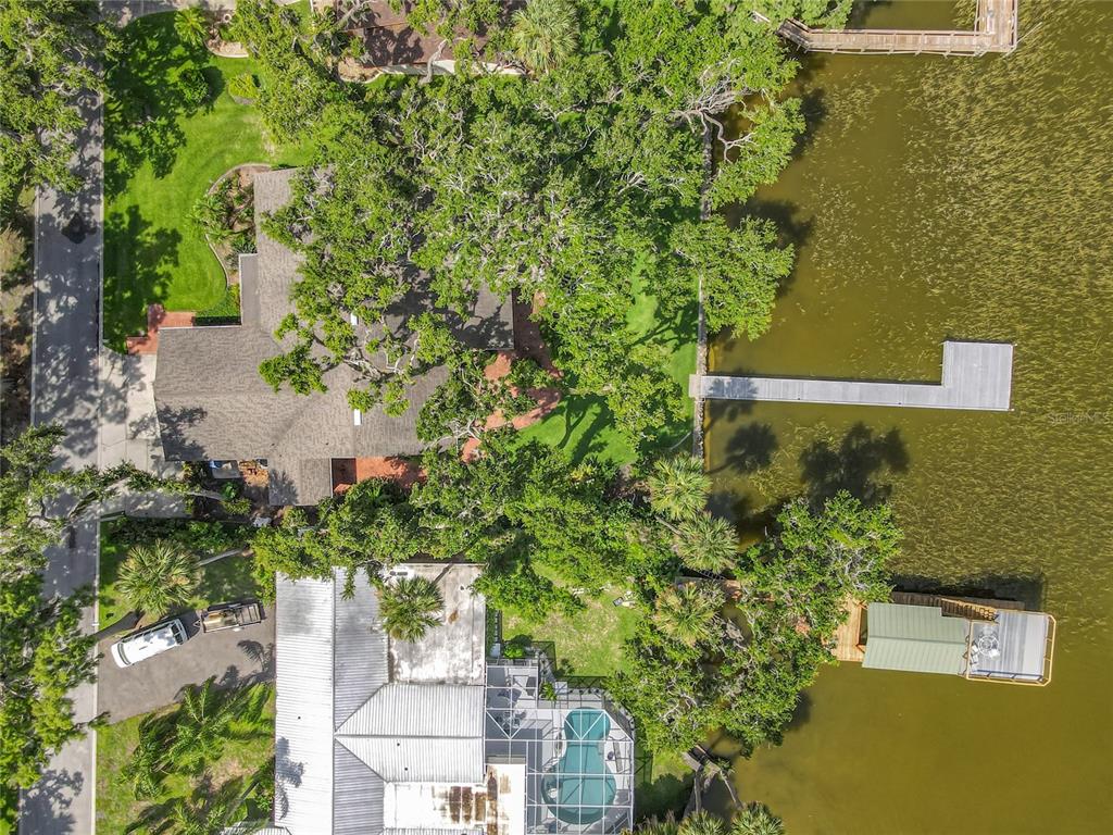 504 Banning Beach Road Tavares, FL 32778 - Photo 36 of 44 an aerial view of a house with a yard