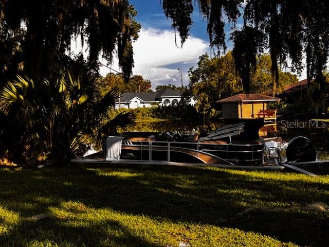 504 Banning Beach Road Tavares, FL 32778 - Photo 41 of 44 a view of a house with a yard
