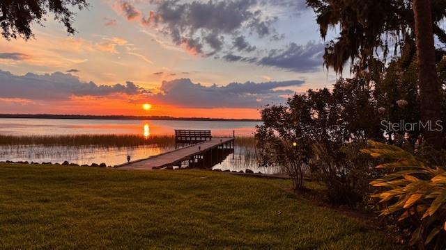 504 Banning Beach Road Tavares, FL 32778 - Photo 43 of 44 a view of a lake and sunset