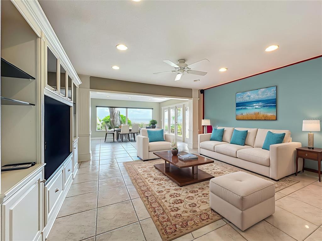 504 Banning Beach Road Tavares, FL 32778 - Photo 6 of 44 a living room with furniture a flat screen tv and a refrigerator