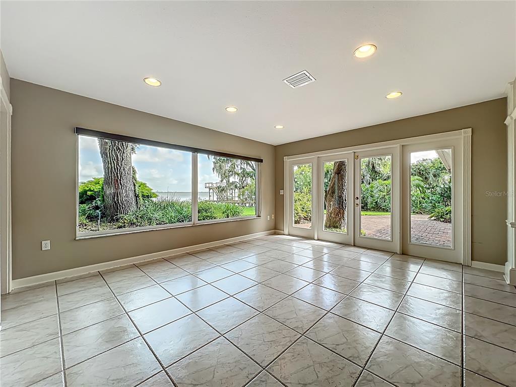 504 Banning Beach Road Tavares, FL 32778 - Photo 9 of 44 a view of an empty room with a window