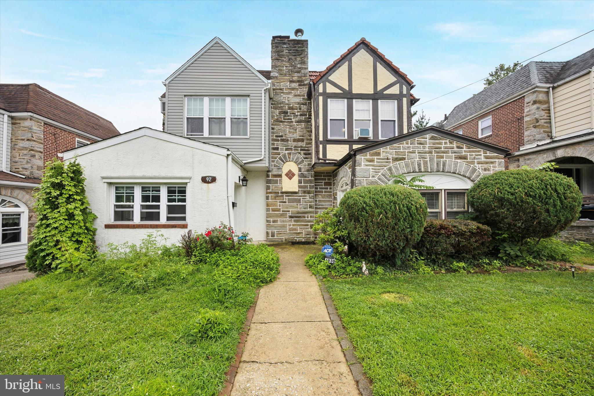 4930 State Road Drexel Hill, PA 19026 - Photo 1 of 18 a front view of a house with garden