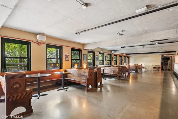 a lobby with furniture and wooden floor