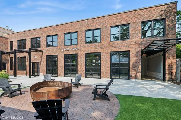 a view of backyard with outdoor seating and green space