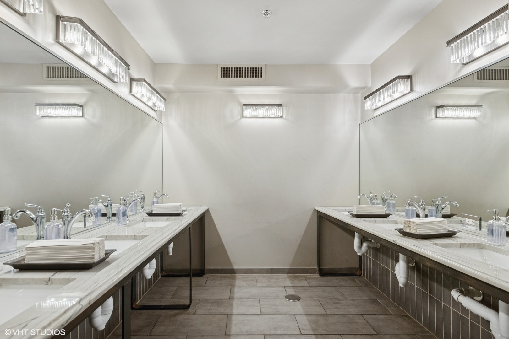 201 South Ashland Avenue Chicago, IL 60607 - Photo 24 of 41 a bathroom with a double vanity sink and a mirror