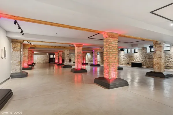a lobby with furniture and floor to ceiling window