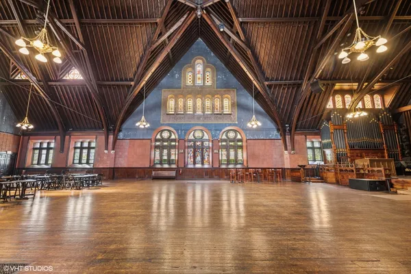a view of a living room with hardwood floor