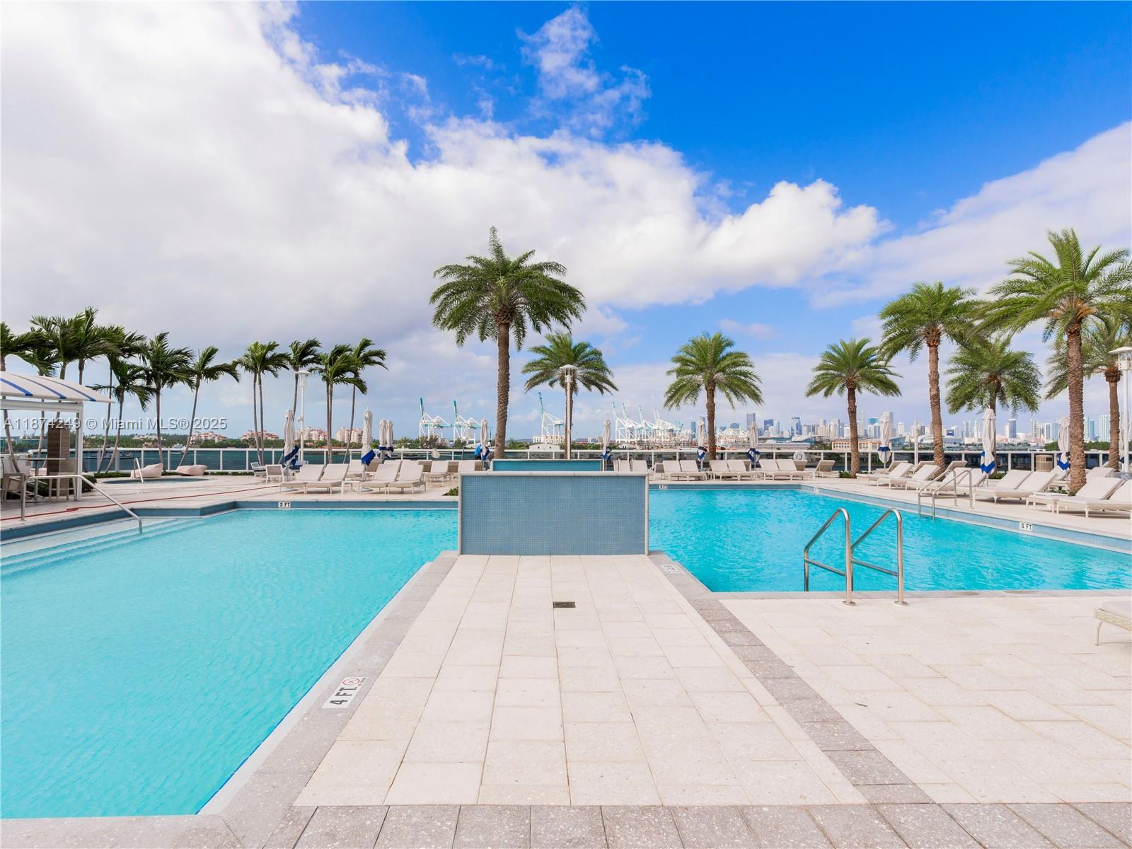 400 Alton Road, Unit 1104 Miami Beach, FL 33139 - Photo 20 of 27 a swimming pool with outdoor seating and yard