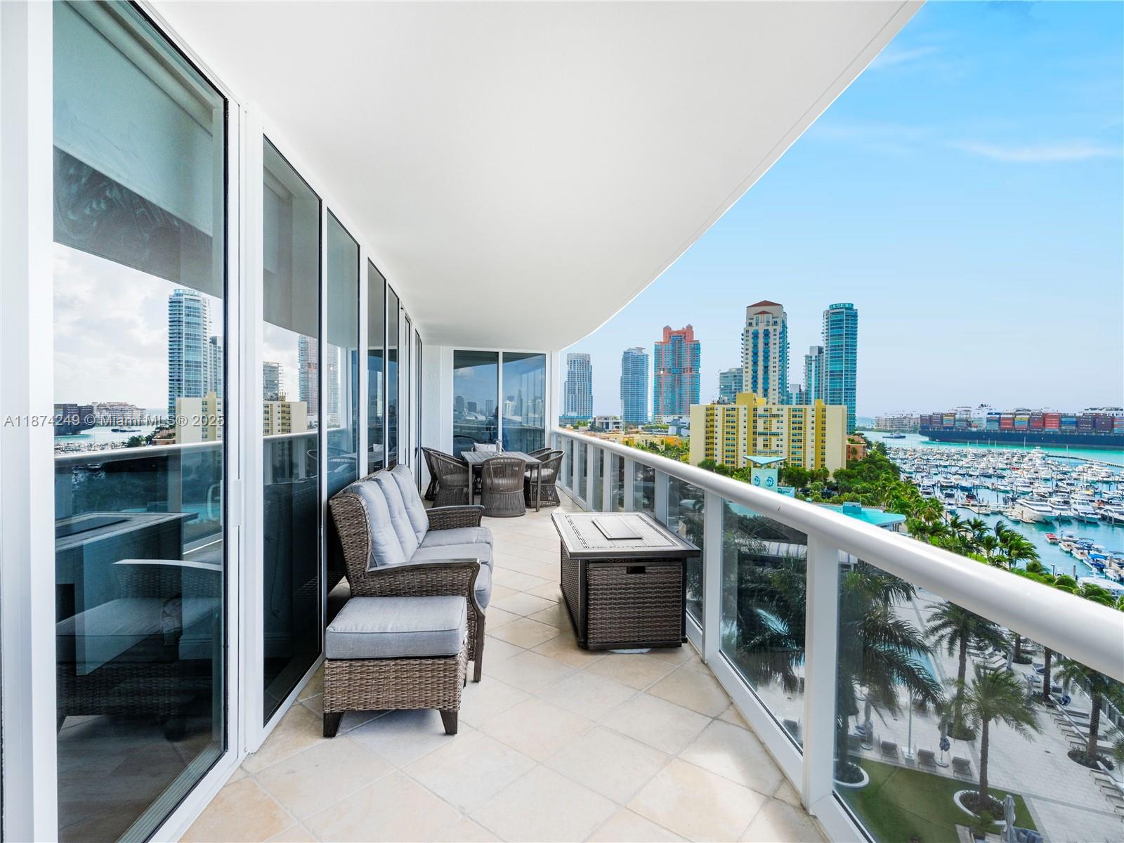 400 Alton Road, Unit 1104 Miami Beach, FL 33139 - Photo 3 of 27 a balcony with furniture and city view