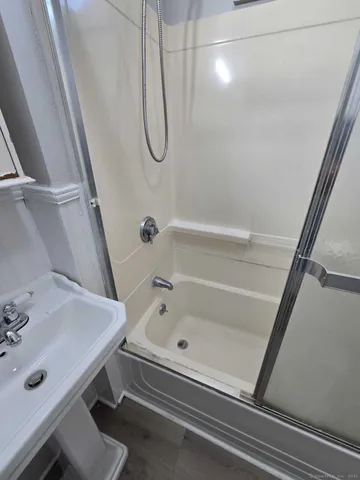 a bathroom with a sink and a shower