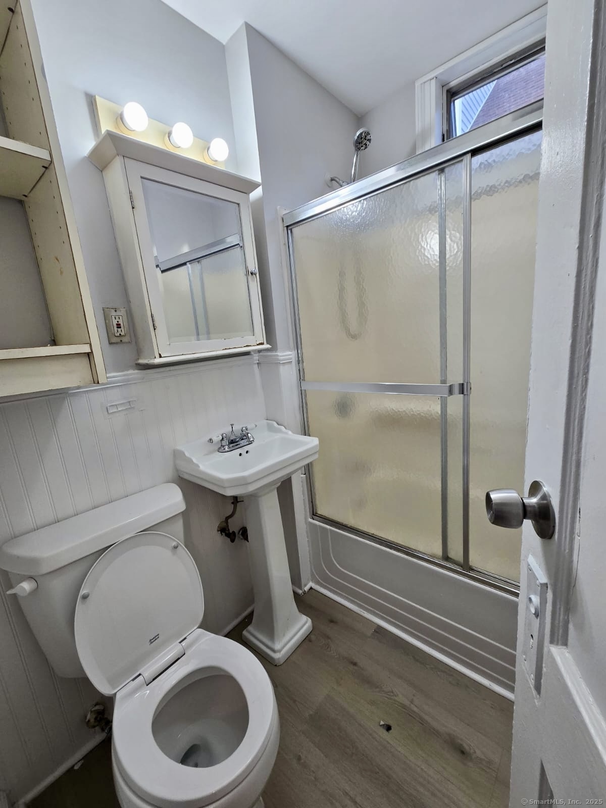 121 2nd Avenue West Haven, CT 06516 - Photo 12 of 17 a bathroom with a toilet a sink and mirror
