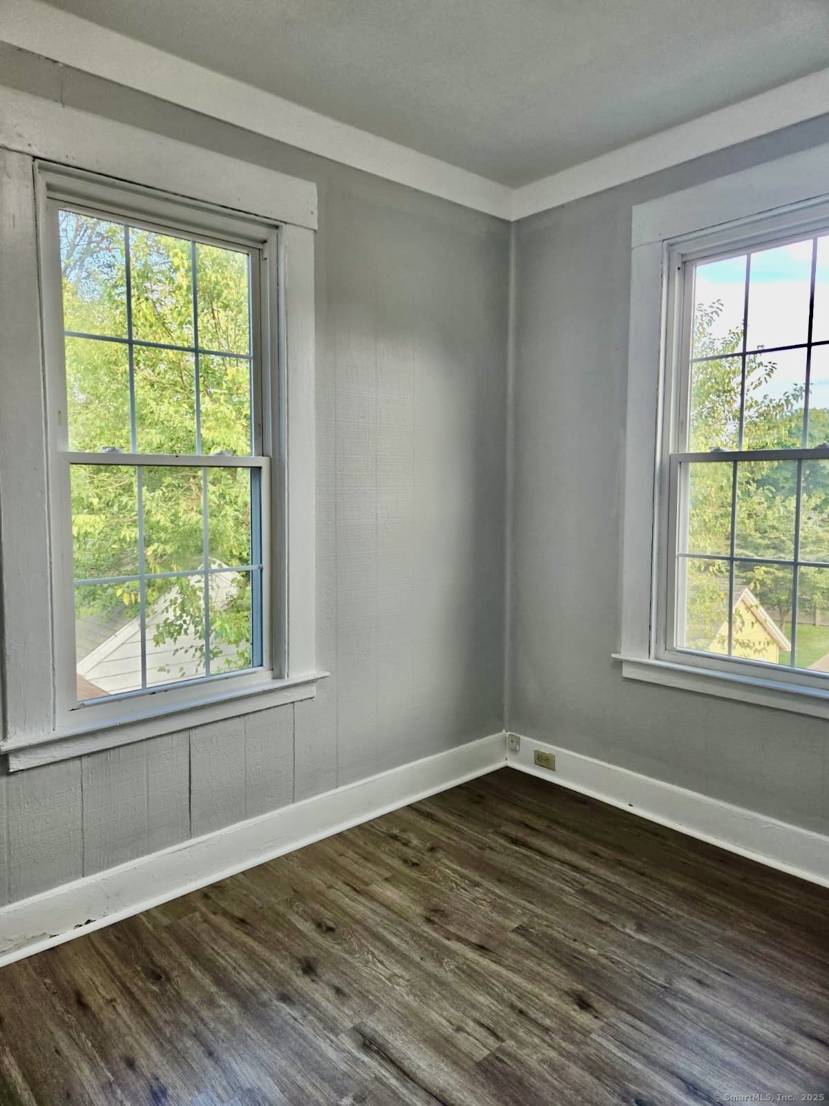 121 2nd Avenue West Haven, CT 06516 - Photo 8 of 17 a view of an empty room with wooden floor and a window