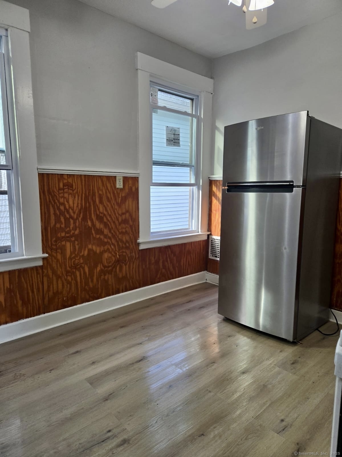 121 2nd Avenue West Haven, CT 06516 - Photo 10 of 17 a view of an empty room with wooden floor and a window