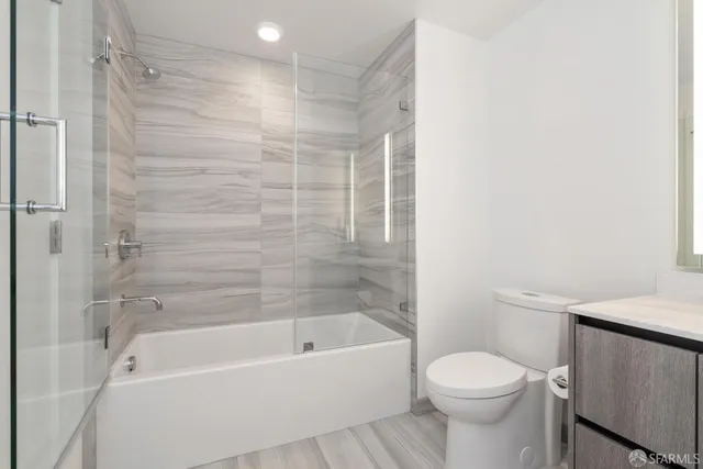 a bathroom with a bathtub and a toilet