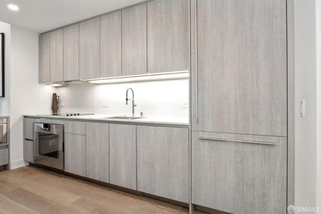 a kitchen with a sink and cabinets