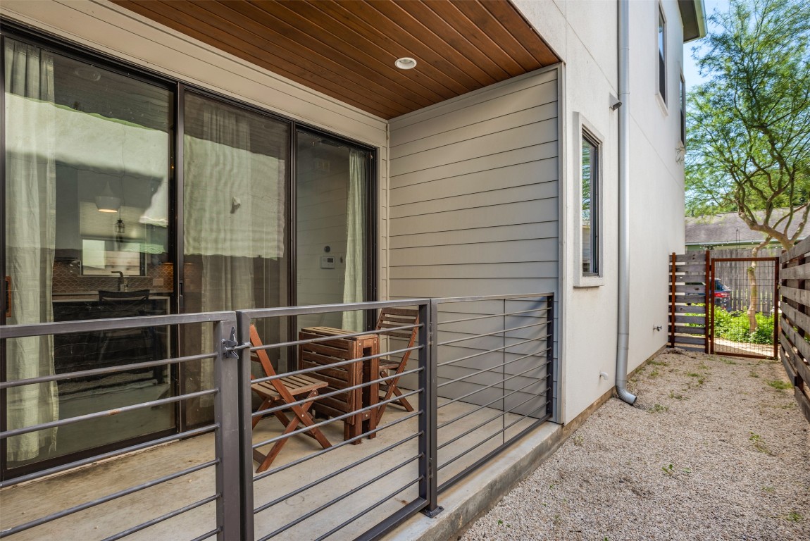 1009 East 12th Street Austin, TX 78702 - Photo 26 of 27 a view of a porch with wooden floor and fence