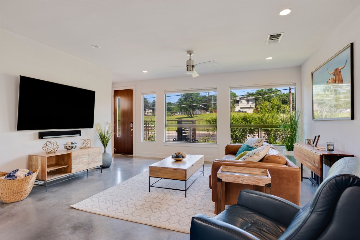 1009 East 12th Street Austin, TX 78702 - Photo 8 of 27 a living room with furniture and a flat screen tv