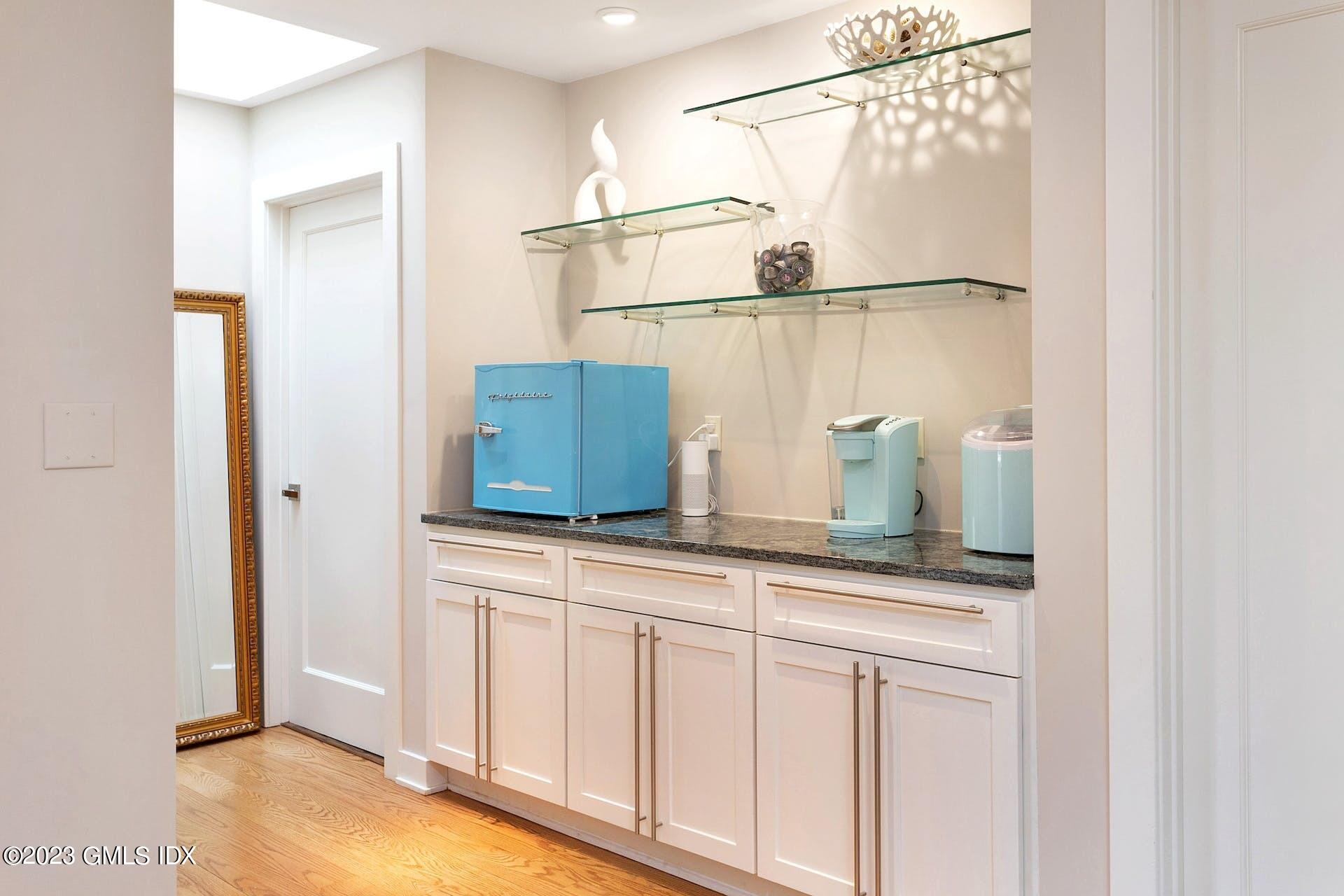 62 Morningside Drive Greenwich, CT 06830 - Photo 25 of 31 a kitchen with a refrigerator and cabinets