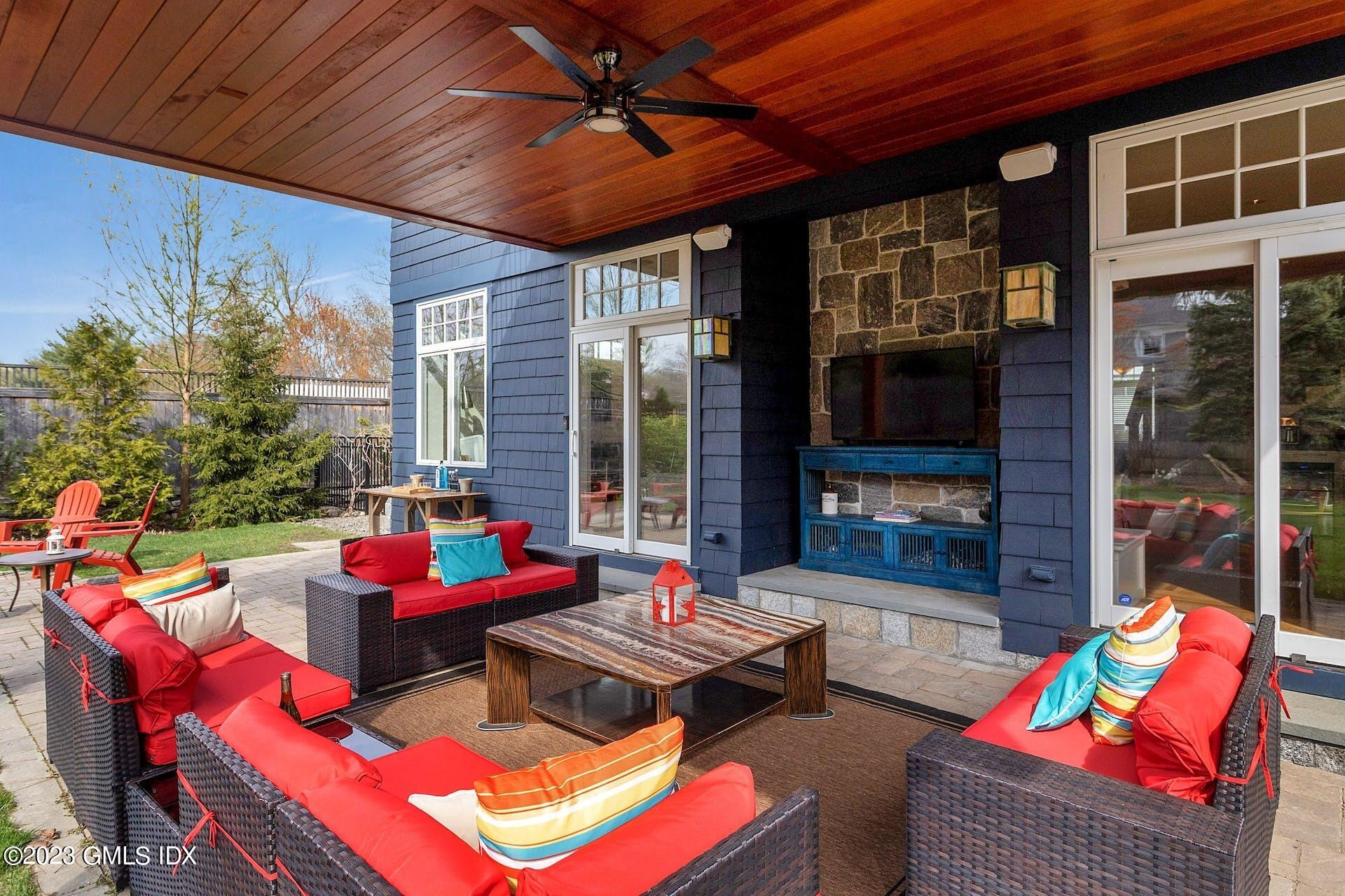 62 Morningside Drive Greenwich, CT 06830 - Photo 26 of 31 a outdoor living space with furniture and a fireplace