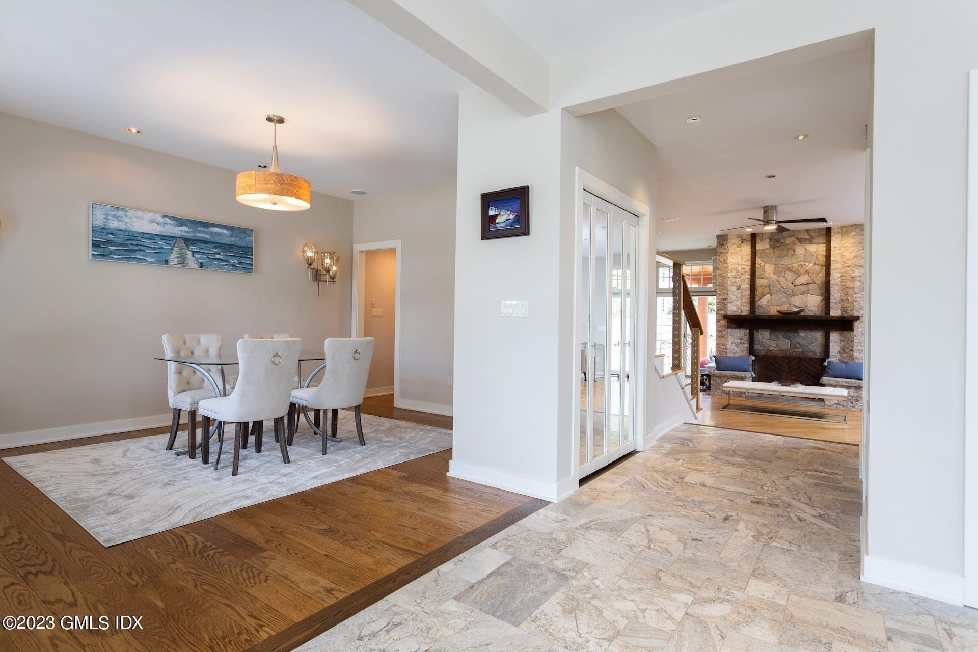 62 Morningside Drive Greenwich, CT 06830 - Photo 7 of 31 a view of a dining room with furniture and chandelier