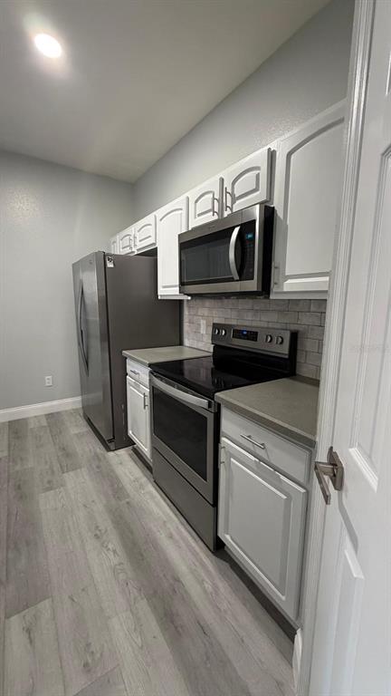 13584 Turtle Marsh Loop, Unit 113 Orlando, FL 32837 - Photo 6 of 29 a utility room with washer and dryer