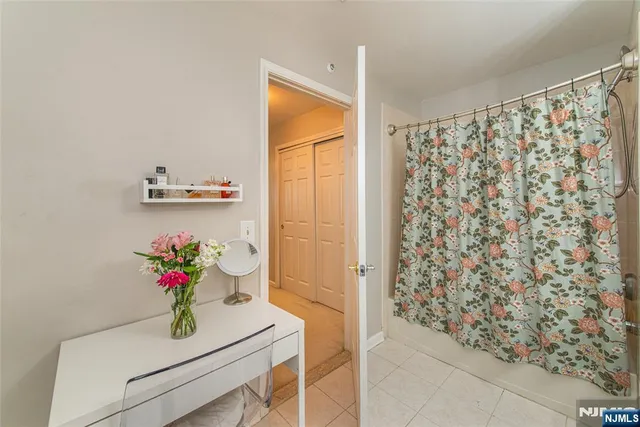 a bathroom with a shower curtain and a sink