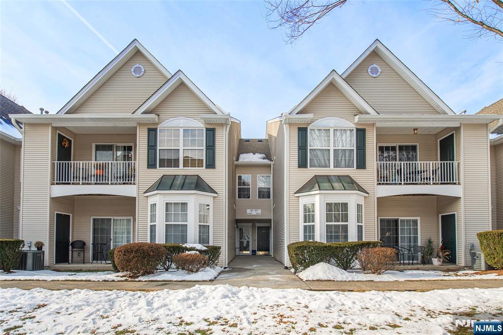 454 Cambridge Drive Butler, NJ 07405 - Photo 2 of 38 a front view of a house with a yard