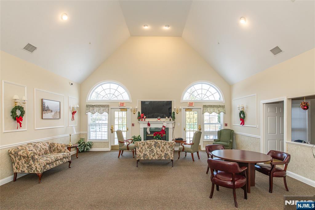 454 Cambridge Drive Butler, NJ 07405 - Photo 22 of 38 a living room with furniture and a large window