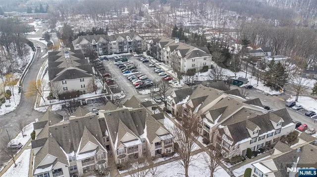 an aerial view of residential house and green space