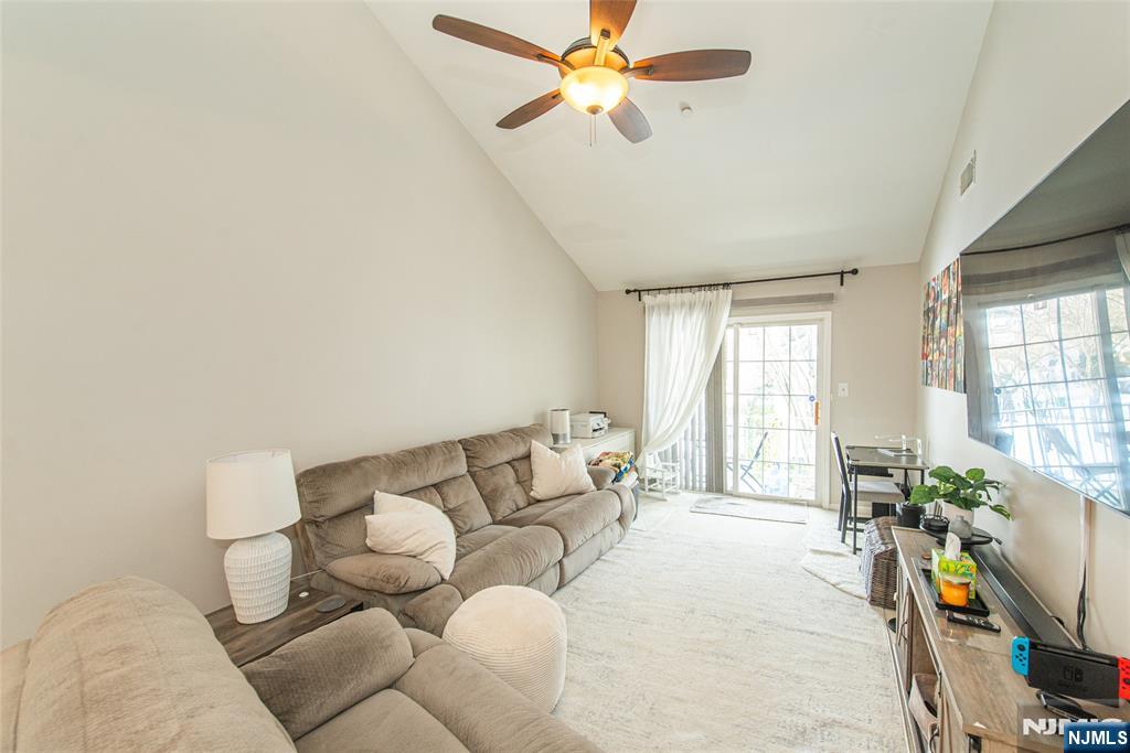454 Cambridge Drive Butler, NJ 07405 - Photo 3 of 38 a living room with furniture and a potted plant