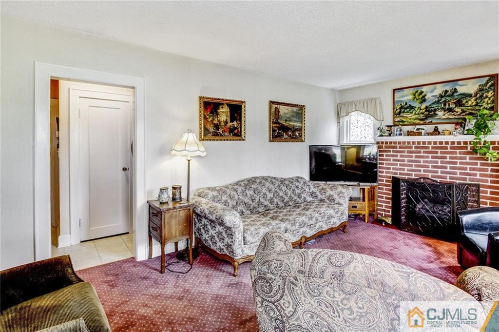 52 Cottrell Road Old Bridge, NJ 07747 - Photo 8 of 23 a bedroom with a bed and a couch